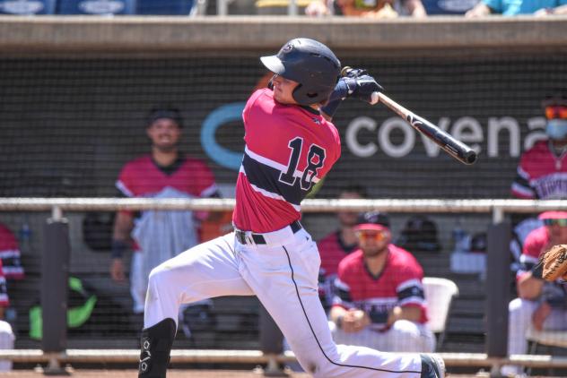 Griffin Conine of the Pensacola Blue Wahoos follows through on his swing