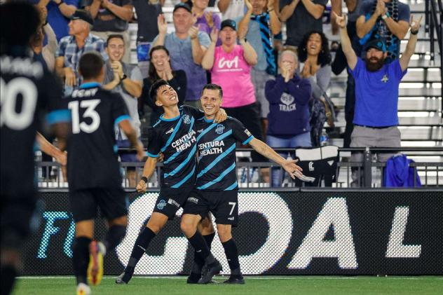 Colorado Springs Switchbacks FC celebrate with José Torres (right) after his goal