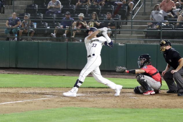 Tri-City Dust Devils first baseman Kenyon Yovan takes a big swing