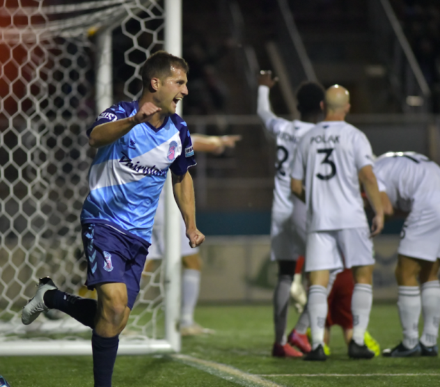 Forward Madison FC celebrates a goal against Greenville Triumph SC