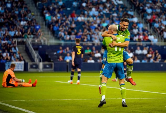 Seattle Sounders FC react after a goal against Sporting Kansas City