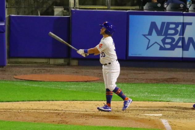 Mark Payton of the Syracuse Mets watches his home run ball fly out of the ballpark on Wednesday night