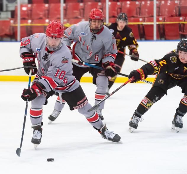 New Jersey Titans forward Tommy Bannister handles the puck