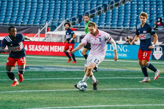 Forward Madison FC defender Connor Tobin with possession against New England Revolution II
