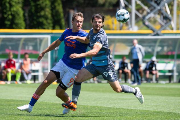 Tacoma Defiance midfielder Tom Brewitt (right)