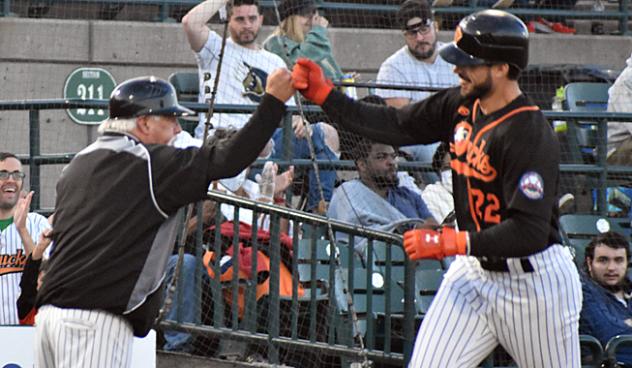 Chris Shaw of the Long Island Ducks gets a fist bump following his home run