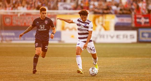 Louisville City FC defender Jonathan Gomez (right) vs. the Indy Eleven