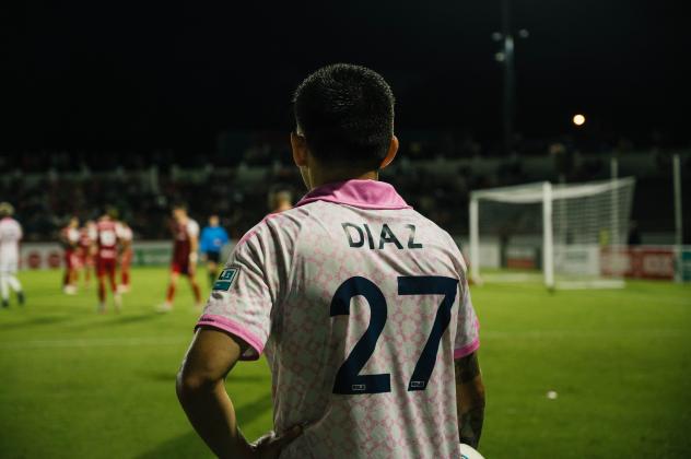 Forward Madison FC defender Christian Diaz observes the action