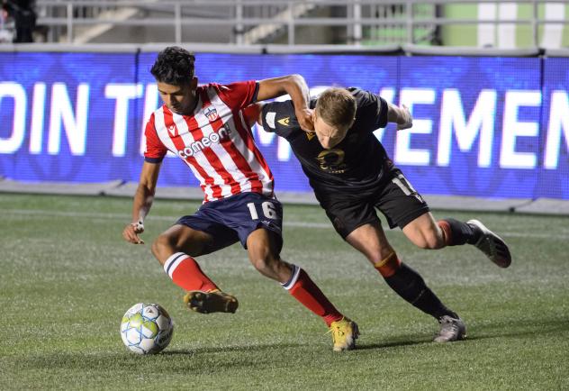 Atlético Ottawa midfielder Zachary Verhoven (left) vs. Valour FC