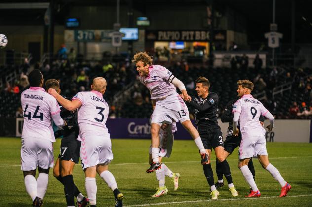 Forward Madison FC defender Connor Tobin goes high vs. Union Omaha