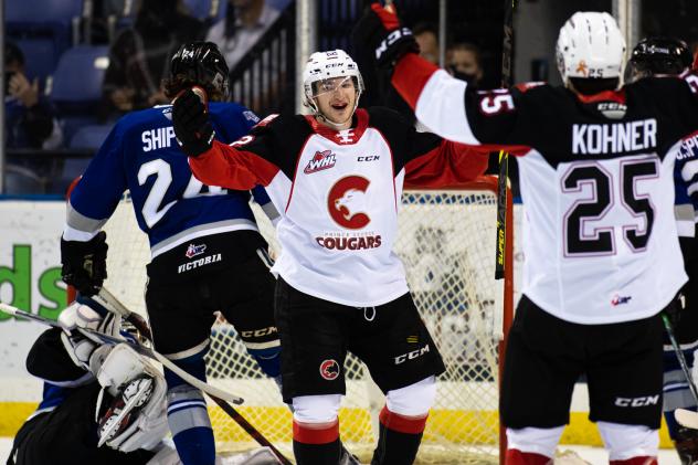 Prince George Cougars celebrate a goal against the Victoria Royals