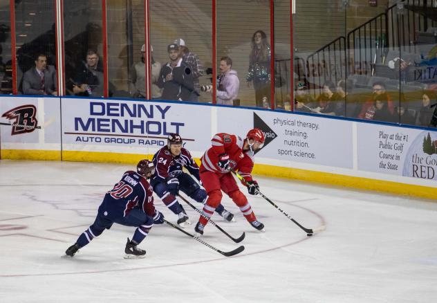 Rapid City Rush center Hudson Elynuik (right) vs. the Tulsa Oilers