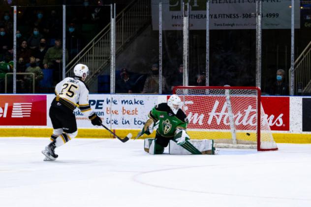 Tyson Zimmer of the Brandon Wheat Kings scores against the Prince Albert Raiders