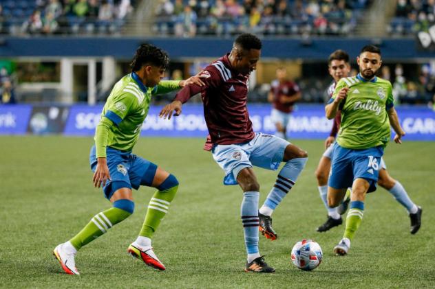 Seattle Sounders FC midfielder Alex Roldan (right)