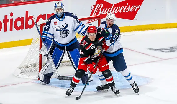 Grand Rapids Griffins right wing Dominik Shine set up vs. the Manitoba Moose