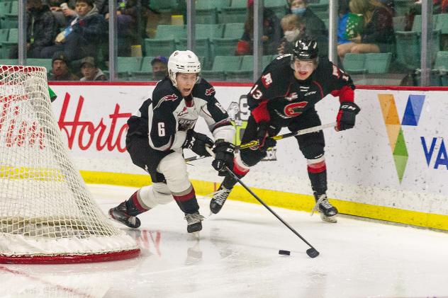 Vancouver Giants defenceman Evan Toth (left) vs. the Prince George Cougars