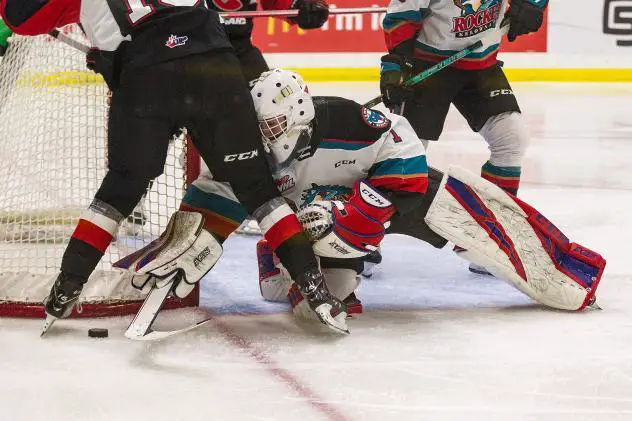Kelowna Rockets goaltender Colby Knight reaches for a puck against the Prince George Cougars