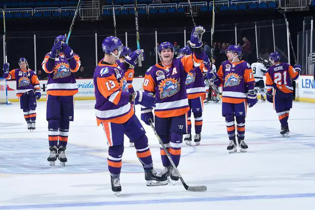 Orlando Solar Bears salute the fans as they head off the ice