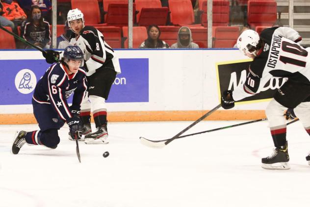 Vancouver Giants left wing Zack Ostapchuk (right) vs. the Tri-City Americans