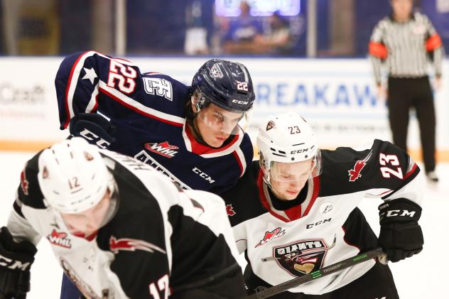 Vancouver Giants forwards Adam Hall (left) and Kyle Bochek vs. the Tri-City Americans