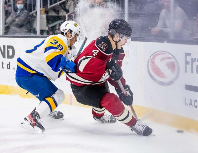 Red Deer Rebels defenceman Christoffer Sedoff (right) vs. the Saskatoon Blades