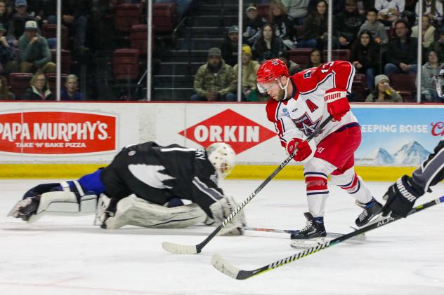Chad Costello of the Allen Americans (right) scores against the Idaho Steelheads