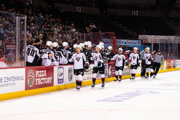 Vancouver Giants exchange congratulations along the bench vs. the Spokane Chiefs