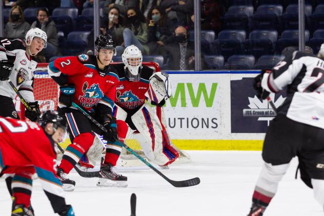 Kelowna Rockets defend against the Vancouver Giants