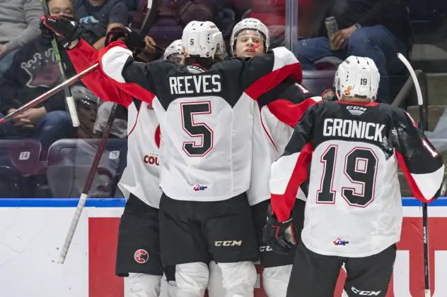 Prince George Cougars celebrate Carter MacAdams' goal against the Seattle Thunderbirds