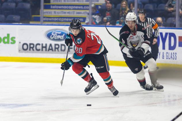 Vancouver Giants centre Ty Thorpe (right) vs. Kelowna Rockets centre Nolan Flamand