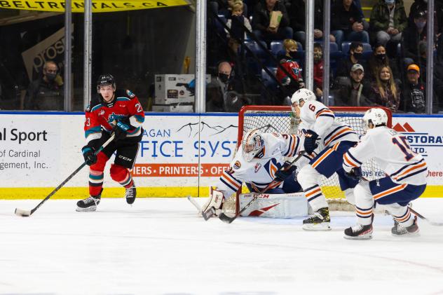 Kelowna Rockets right wing Jake Poole (left) vs. the Kamloops Blazers