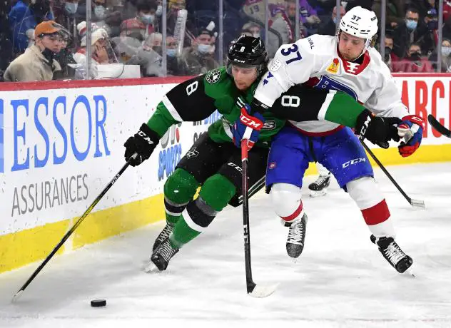 Texas Stars defenseman Thomas Harley (left) vs. the Laval Rocket