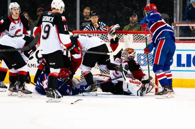 Prince George Cougars goaltender Taylor Gauthier stops a Spokane Chiefs shot