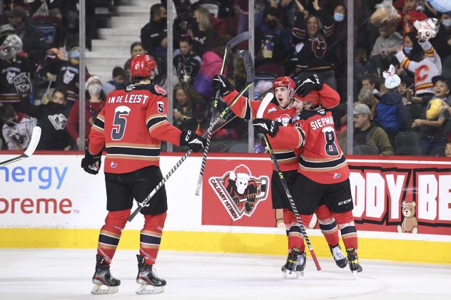 Calgary Hitmen forward Cael Zimmerman and his teammates celebrate his teddy bear goal at the 2021 ENMAX Teddy Bear Toss