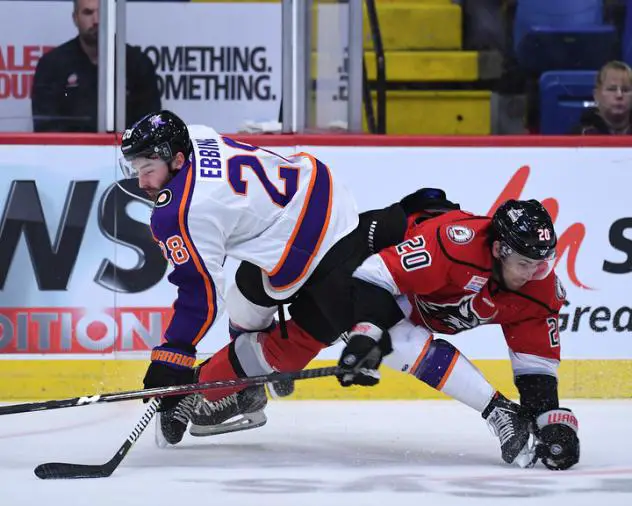 Reading Royals forward Thomas Ebbing (left) delivers a hit vs. the Adirondack Thunder