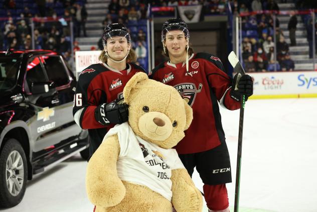 Vancouver Giants right wing Justin Lies (left) and centre Kaden Kohle during the Teddy Bear Toss