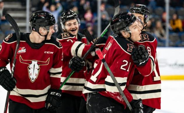 Red Deer Rebels congratulate Dallon Melin after his goal