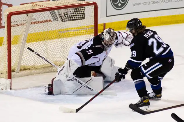 Vancouver Giants goaltender Will Gurski eyes the puck against the Victoria Royals