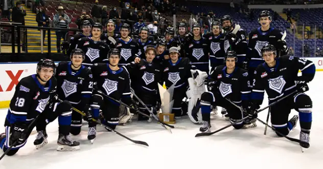 Victoria Royals pose with the Lighthouse Island Bowl Trophy after beating the Vancouver Giants