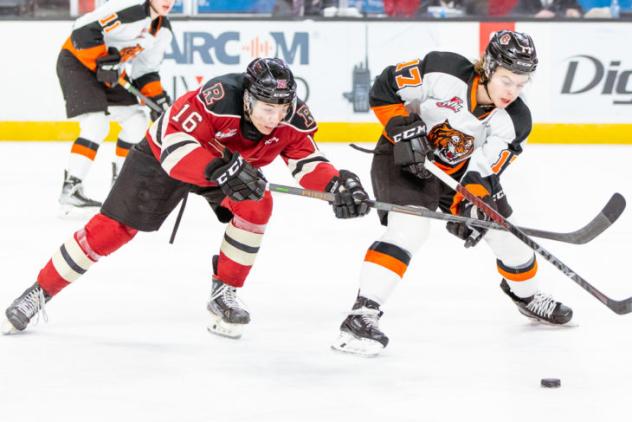 Medicine Hat Tigers left wing Brayden Boehm (right) vs. the Red Deer Rebels