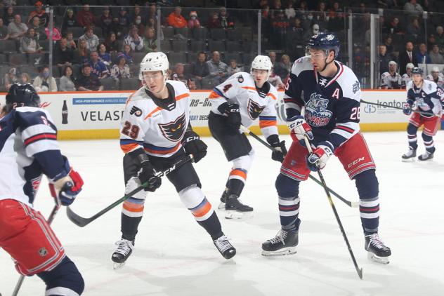 Lehigh Valley Phantoms defenseman Wyatte Wylie (left) vs. the Hartford Wolf Pack