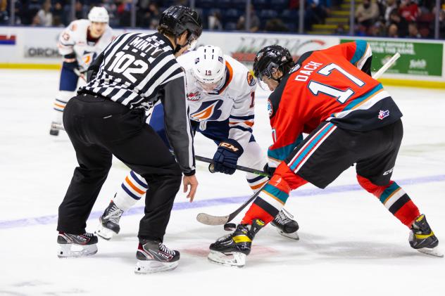 Kelowna Rockets centre Colton Dach (right) faces off with the Kamloops Blazers