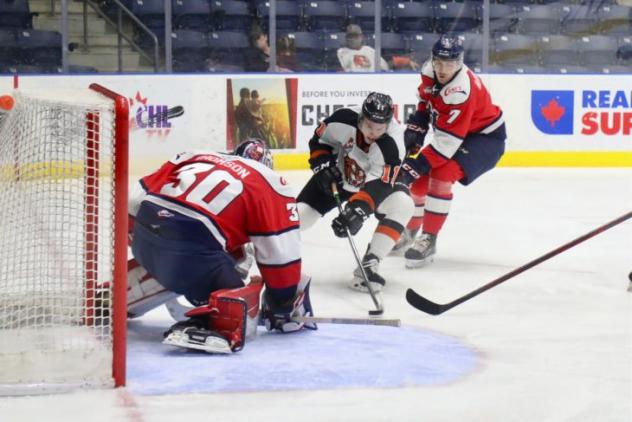 Medicine Hat Tigers left wing Tyler MacKenzie prepares to shoot against the Lethbridge Hurricanes