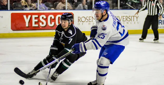 Wichita Thunder forward Logan Fredericks (right) vs. the Utah Grizzlies