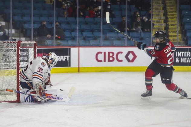 Andrew Cristall of the Kelowna Rockets takes a shot against the Kamloops Blazers