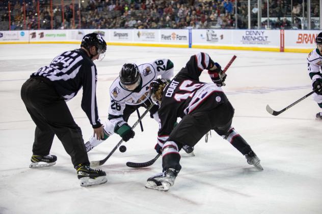 Zach Court of the Rapid City Rush (right) faces off with the Utah Grizzlies