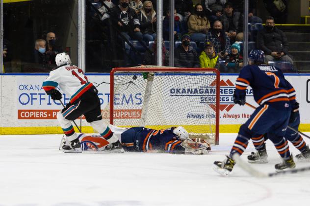 Kelowna Rockets right wing Steel Quiring (left) vs. the Kamloops Blazers