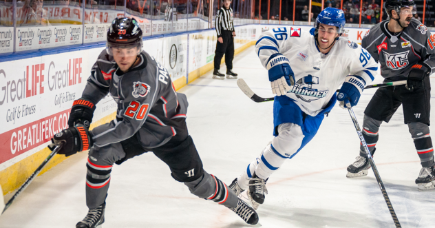 Wichita Thunder defenseman Nick Minerva (right) vs. the Kansas City Mavericks