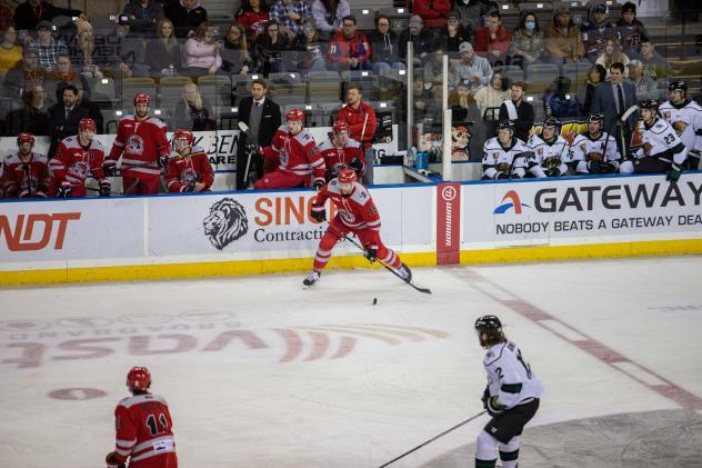 Rapid City Rush defenseman Christian Evers with the puck against the Utah Grizzlies