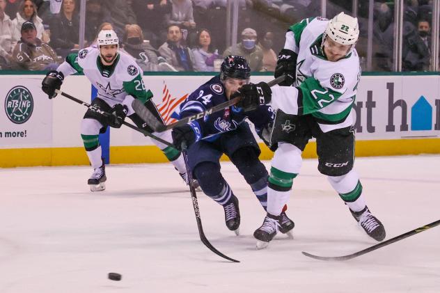 Texas Stars center Rhett Gardner (right) vs. the Manitoba Moose